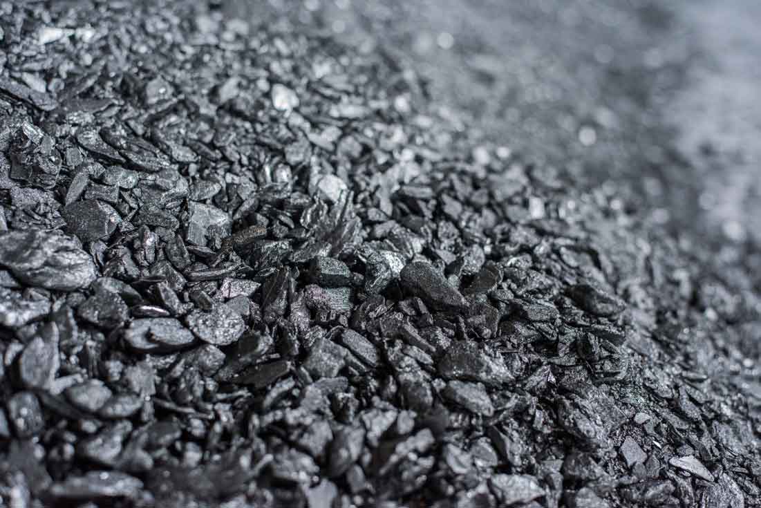 Preview of concept A: crushed crystalline graphite at macro scale, rendered in black and white.