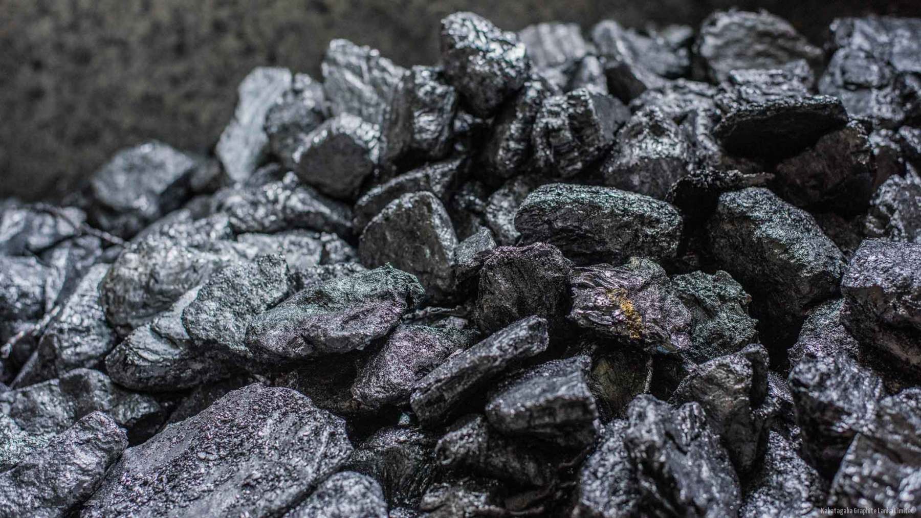 Macro view of lump crystalline vein graphite from the Kahatagaha mine, showing its metallic sheen.